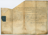 Printed and handwritten document on vellum with portion excised in top left. Also portion of seal at middle left