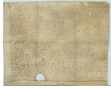 Handwritten document on vellum with medium-sized hole near bottom edge