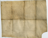 Rectangular vellum document (verso of previous image) showing fold lines and soiling