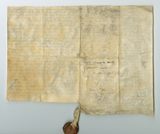 Handwritten vellum document (verso of previous image) with seal at bottom