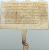 Handwritten vellum document with seal at bottom