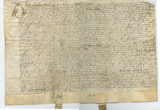 Handwritten vellum document with seal tags at bottom