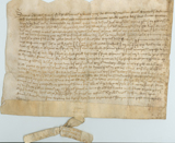 Handwritten vellum document with seal tag at bottom