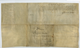 Verso of vellum document with some writing on it
