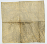 Verso of vellum document with staining along centre creases