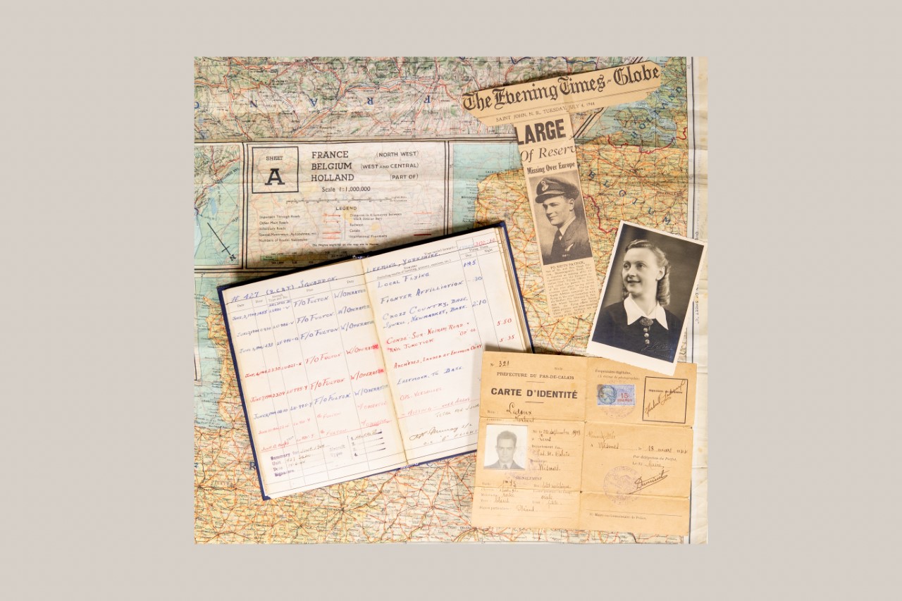 Silk map, photos and flight logbook from the Keith Patrick Archive.