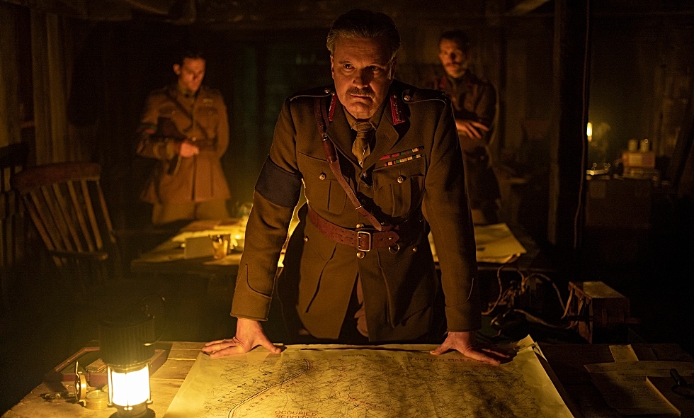 Colin Firth, as General Erinmore in the film 1917, stands over a map from McMaster’s extensive World War One trench map collection.